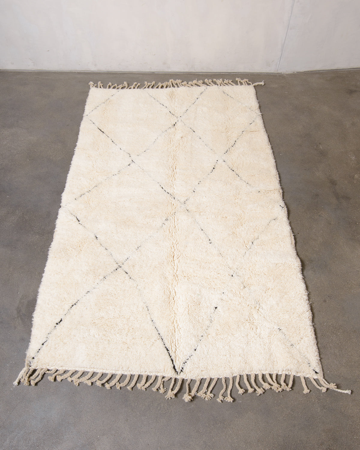 Modern, designer, handcrafted Berber rug from Morocco. Beniourain carpet with minimalist design, natural wool pile and a fluffy texture.
